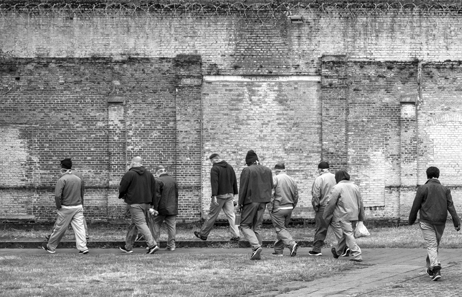 Inmates returning to their cells after a day's work in the Merksplas prison workhouses